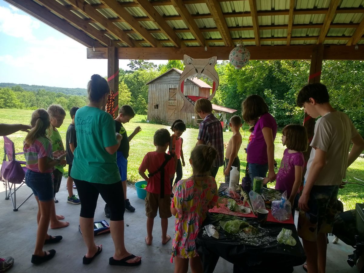 Playing games outside on the farm during a birthday party